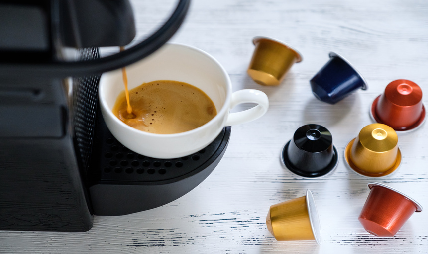  Flowing capsule coffee machine with capsules all around.